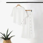 Conjunto de duas peças para mulher: top com bainha assimétrica e calças de perna larga