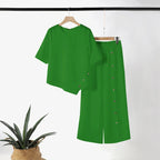 Conjunto de duas peças para mulher: top com bainha assimétrica e calças de perna larga
