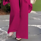 Encantador conjunto de blusa irregular e calças pantalona