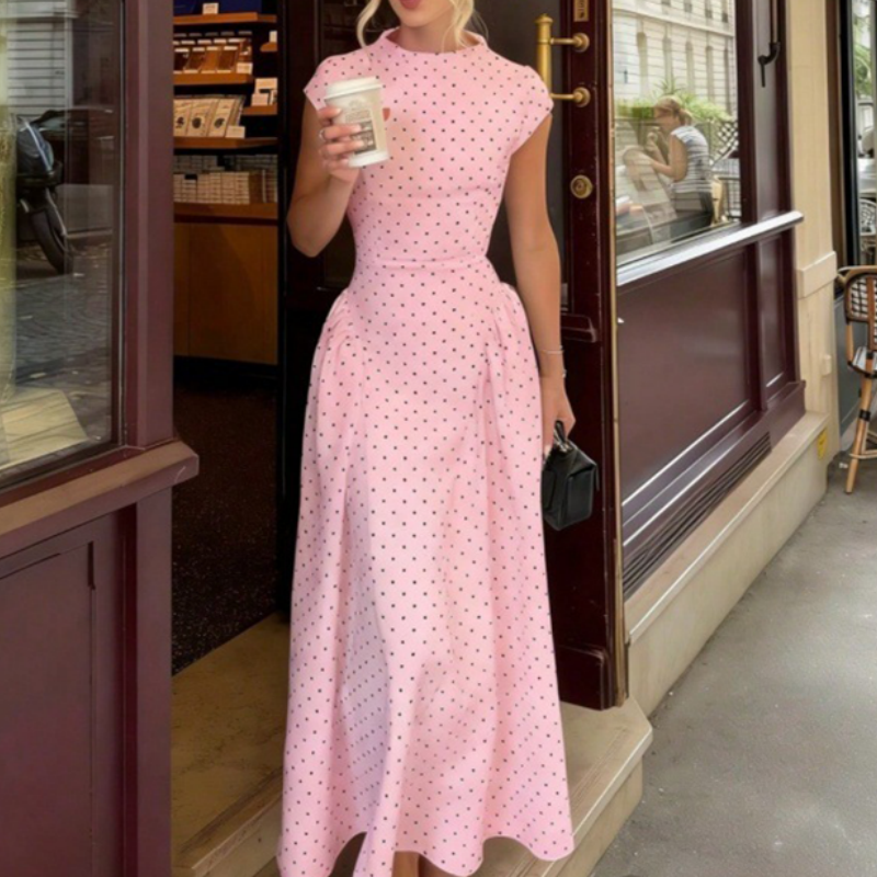 Vestido elegante de mulher às bolinhas com corte em A