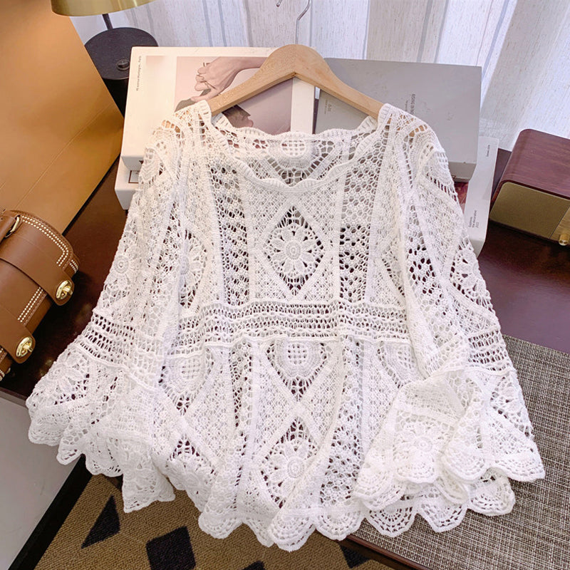Blusa de mulher em renda com inspiração vintage.
