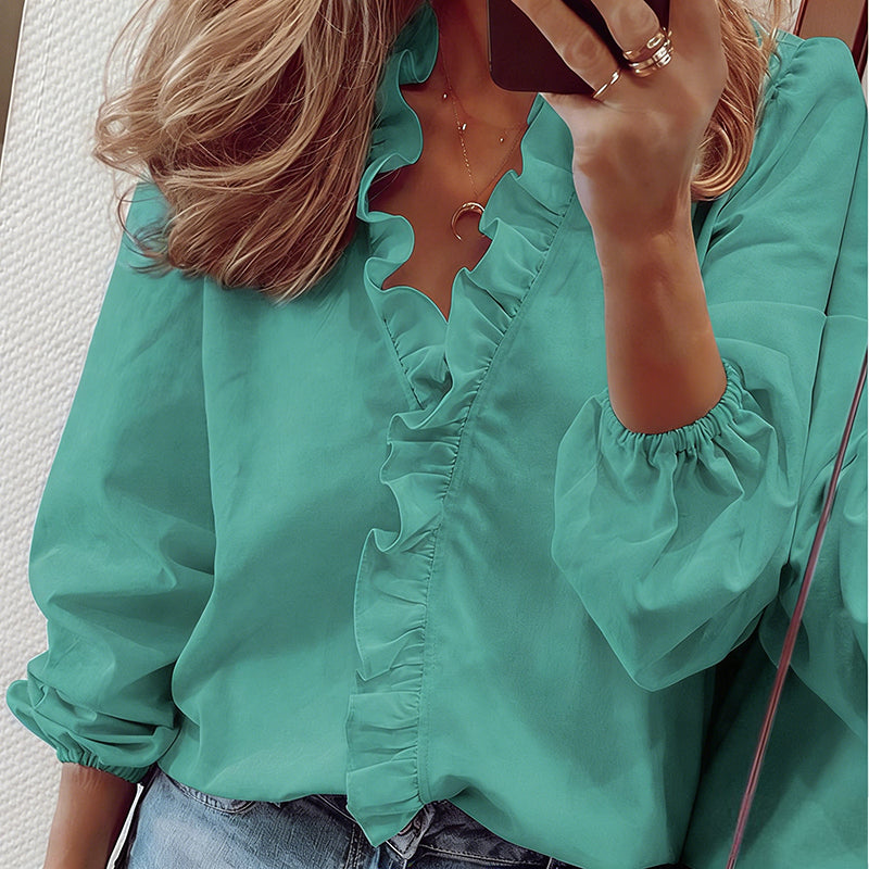 Blusa de mulher de manga comprida com decote em V e folhos