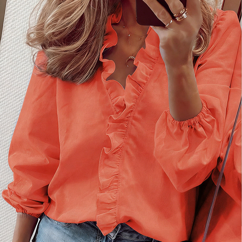 Blusa de mulher de manga comprida com decote em V e folhos