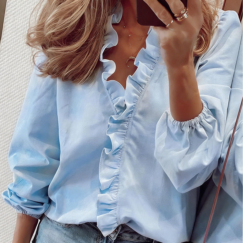 Blusa de mulher de manga comprida com decote em V e folhos